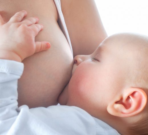 mother is breast-feeding her  baby