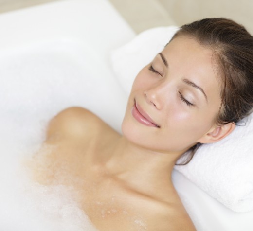 Bathing woman relaxing in bath