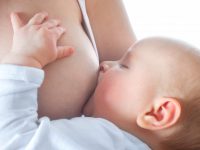 mother is breast-feeding her  baby